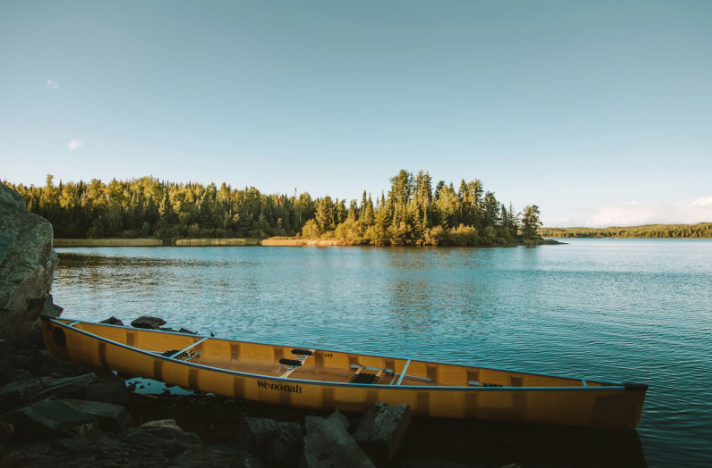 Yellow canoe on body of water